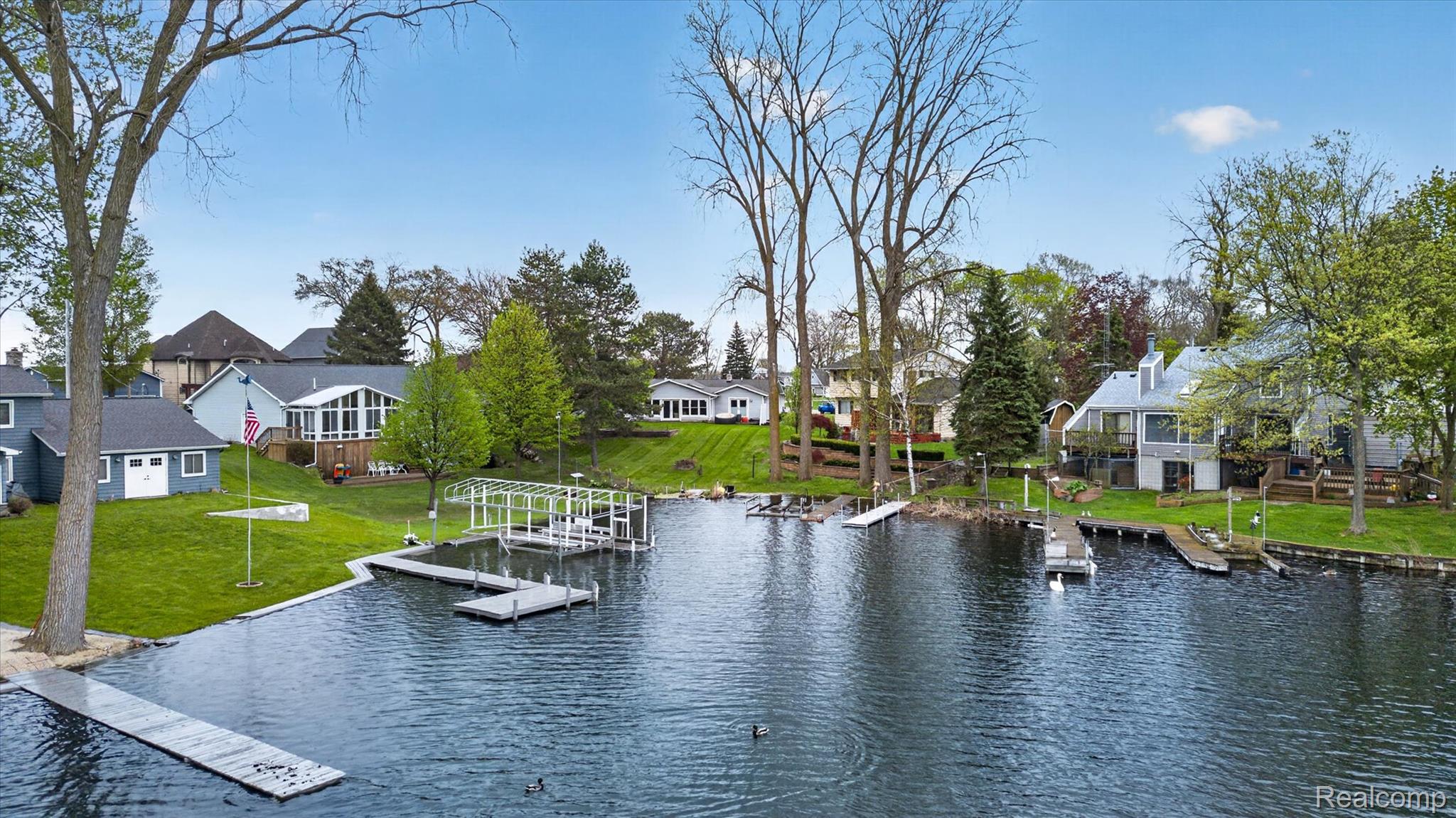 2264 Crane Road Fenton, MI 48430 - Photo 46 of 55 Dock area with a water view, a residential view, and a lawn