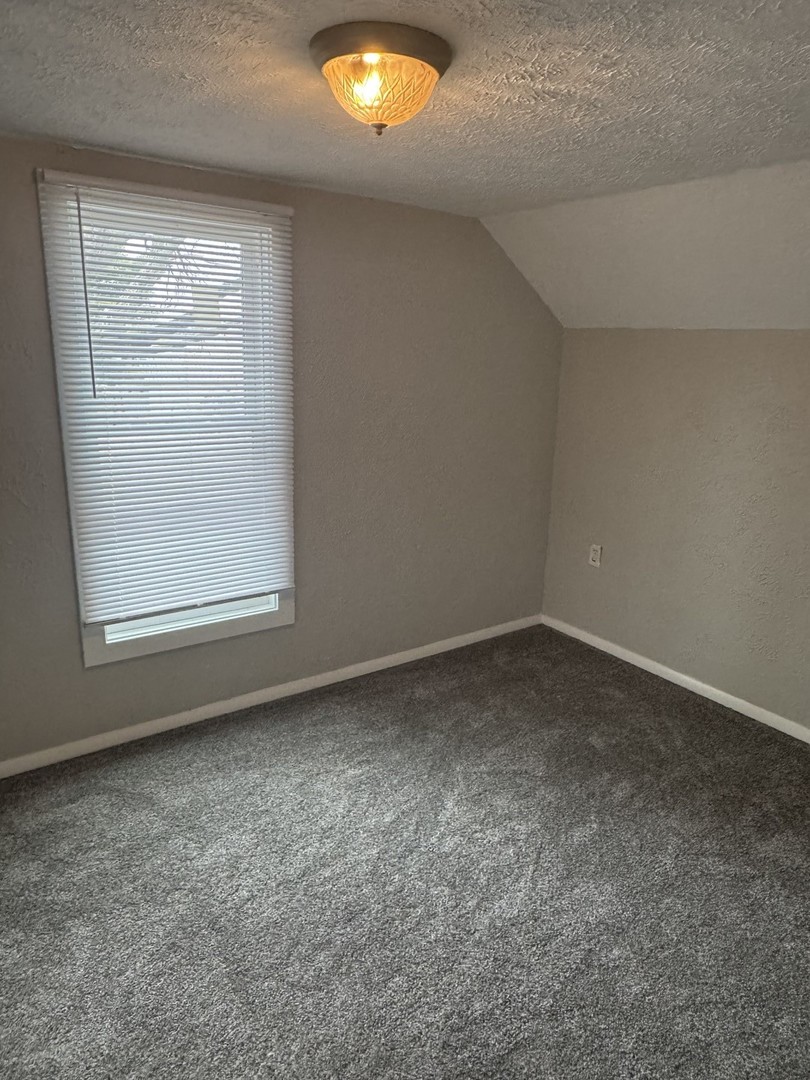 108 East Cleveland Street Heyworth, IL 61745 - Photo 11 of 13 an empty room with a window