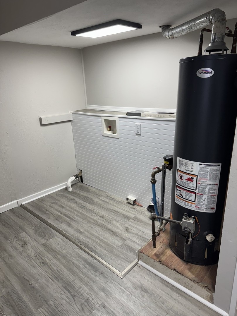 108 East Cleveland Street Heyworth, IL 61745 - Photo 5 of 13 a room with gym equipment and wooden floor