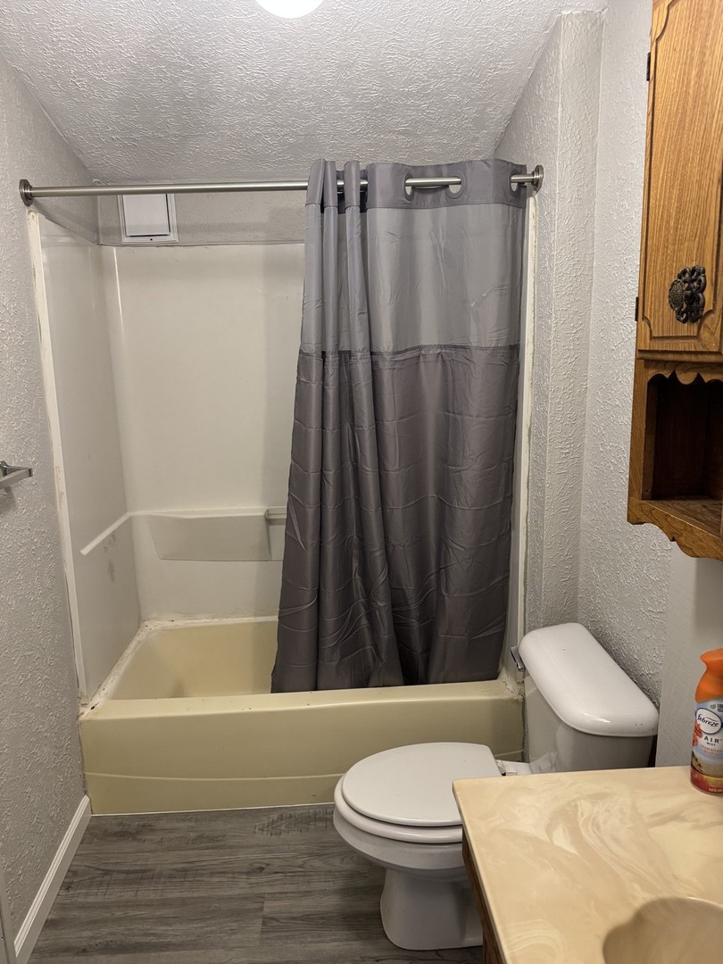 108 East Cleveland Street Heyworth, IL 61745 - Photo 6 of 13 a bathroom with a toilet and a shower
