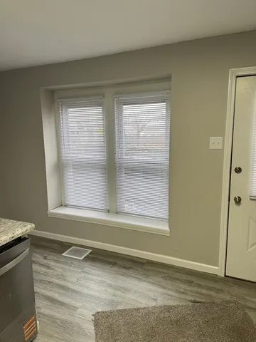 a view of a room that has a window in it