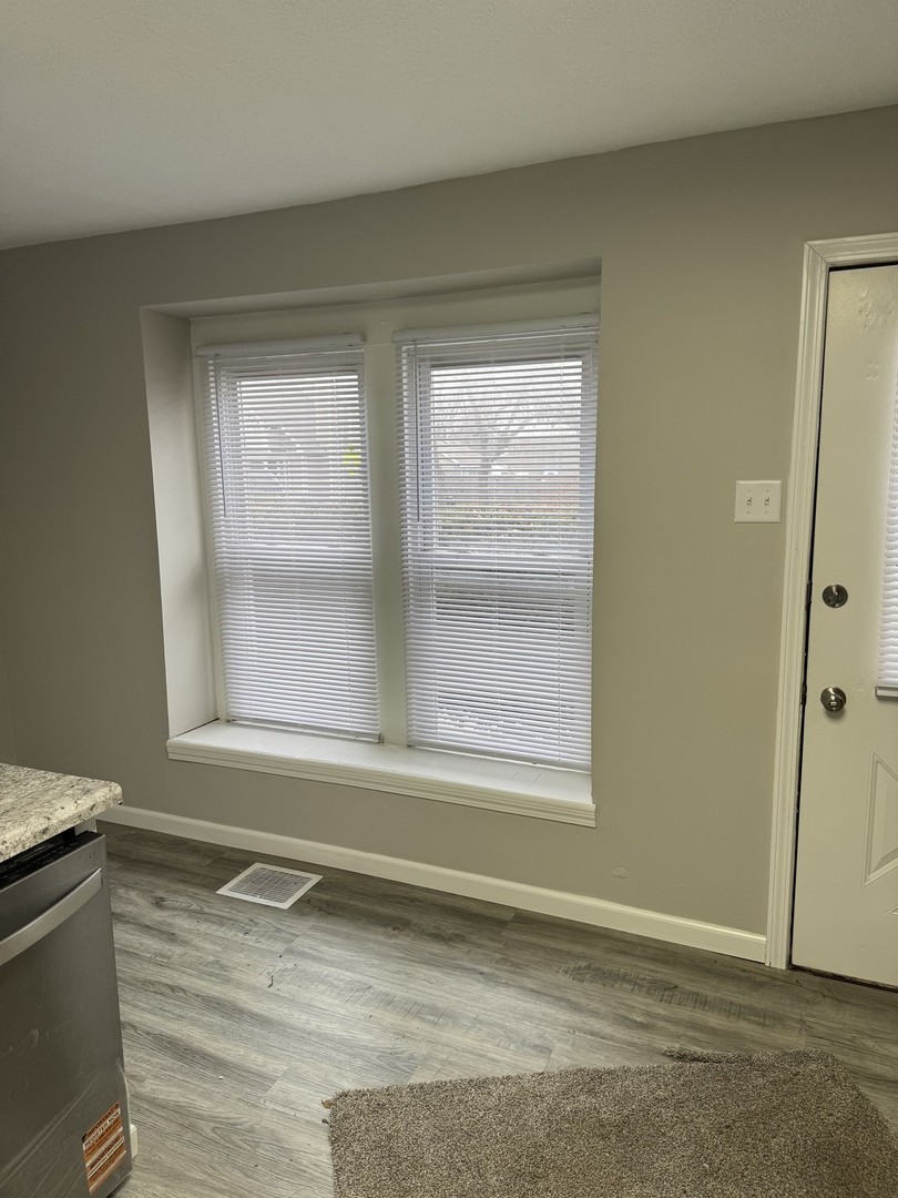 108 East Cleveland Street Heyworth, IL 61745 - Photo 7 of 13 a view of a room that has a window in it