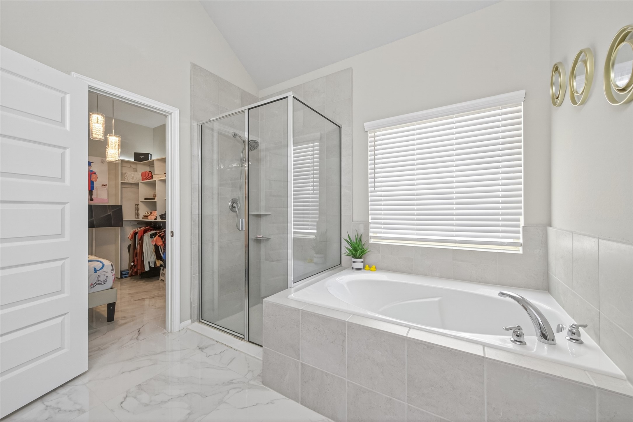 22409 Kinley Street New Caney, TX 77357 - Photo 31 of 46 a bathroom with a tub a toilet and a shower