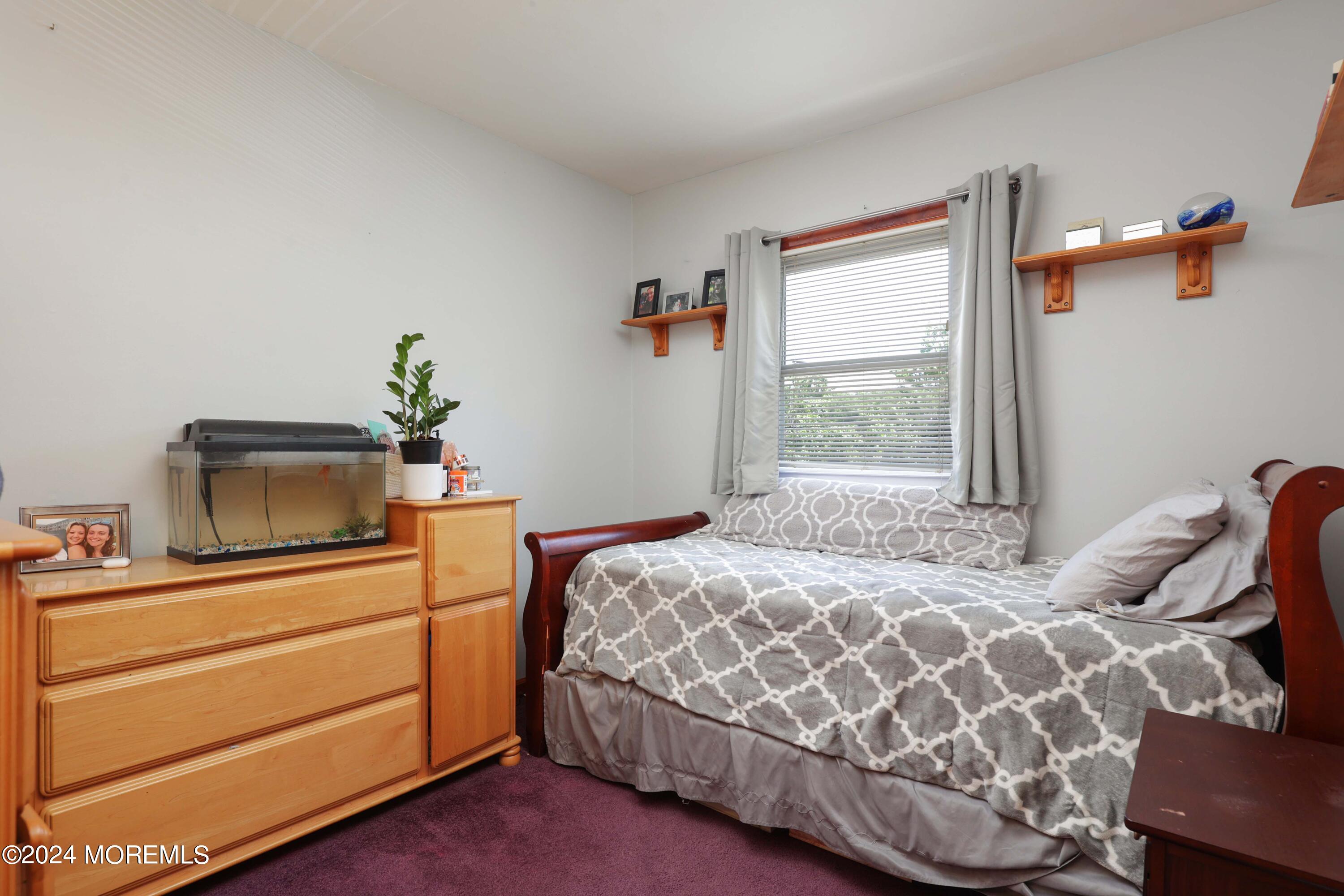 262 Cedar Swamp Road Jackson, NJ 08527 - Photo 13 of 28 a bedroom with a bed and windows