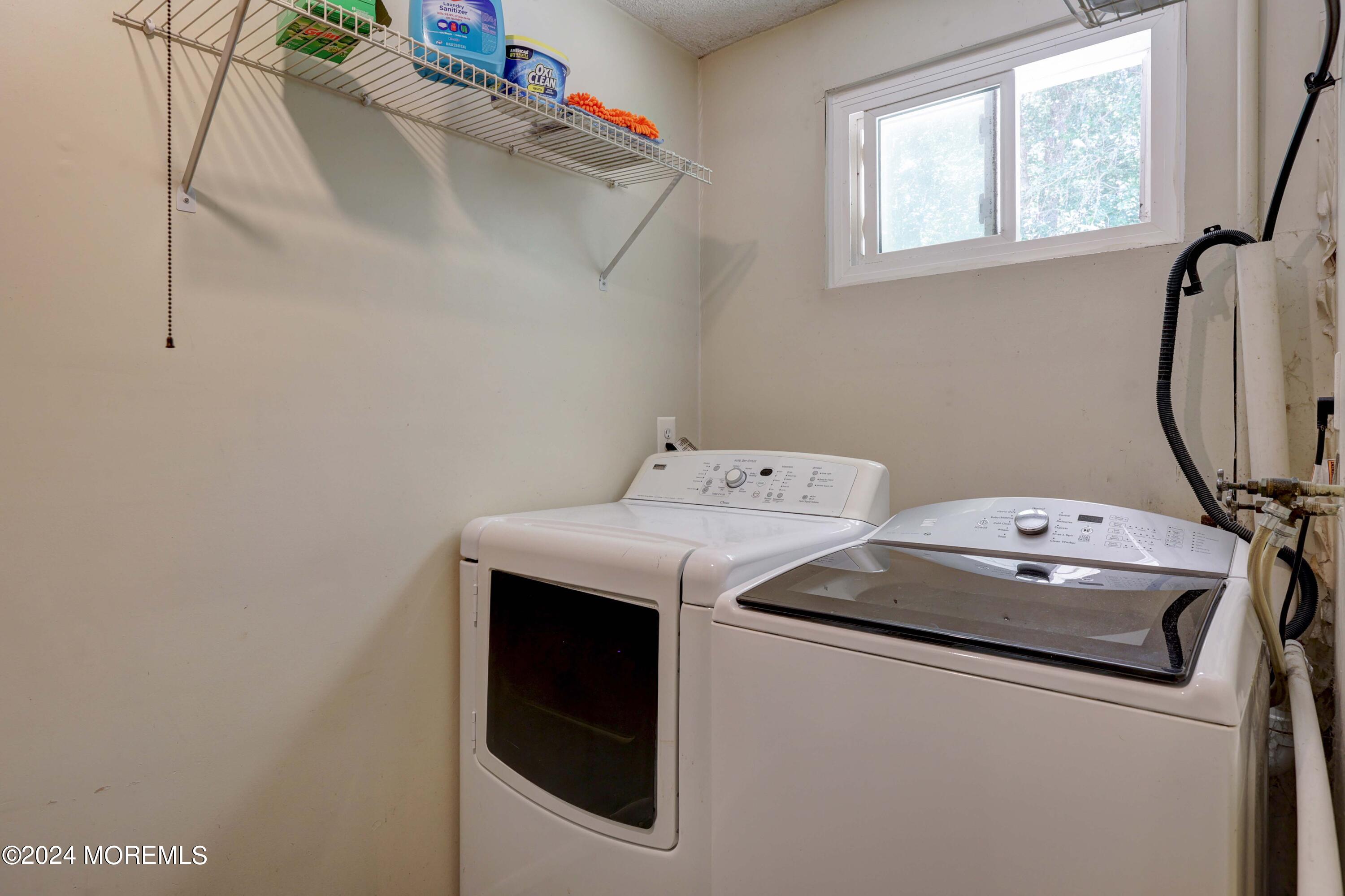 262 Cedar Swamp Road Jackson, NJ 08527 - Photo 17 of 28 a utility room with dryer and washer