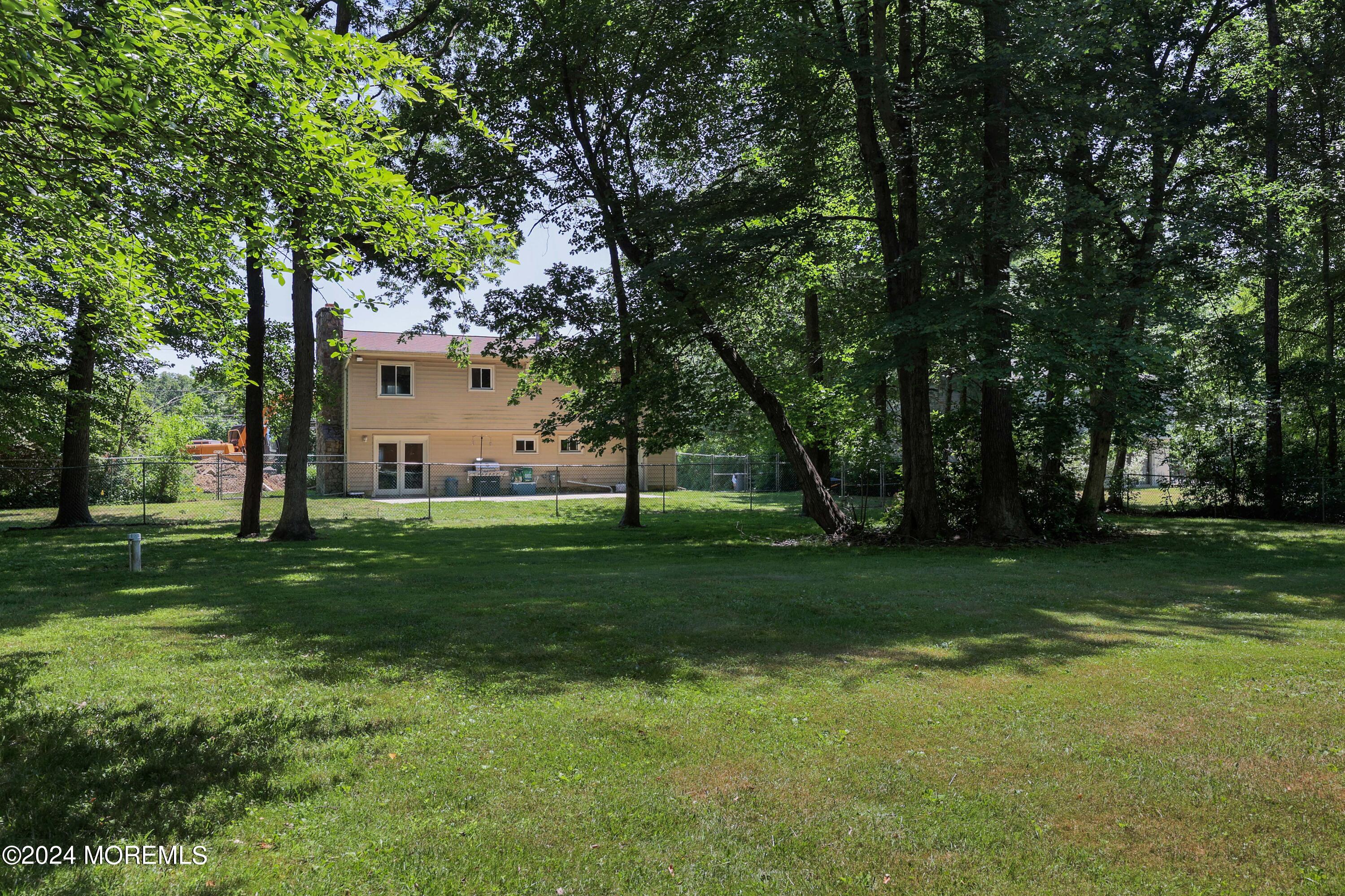 262 Cedar Swamp Road Jackson, NJ 08527 - Photo 27 of 28 a view of a backyard with large trees