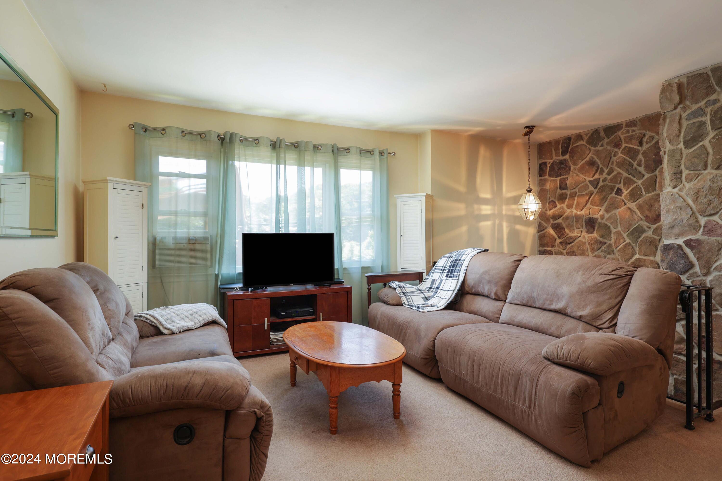 262 Cedar Swamp Road Jackson, NJ 08527 - Photo 3 of 28 a living room with furniture and a flat screen tv