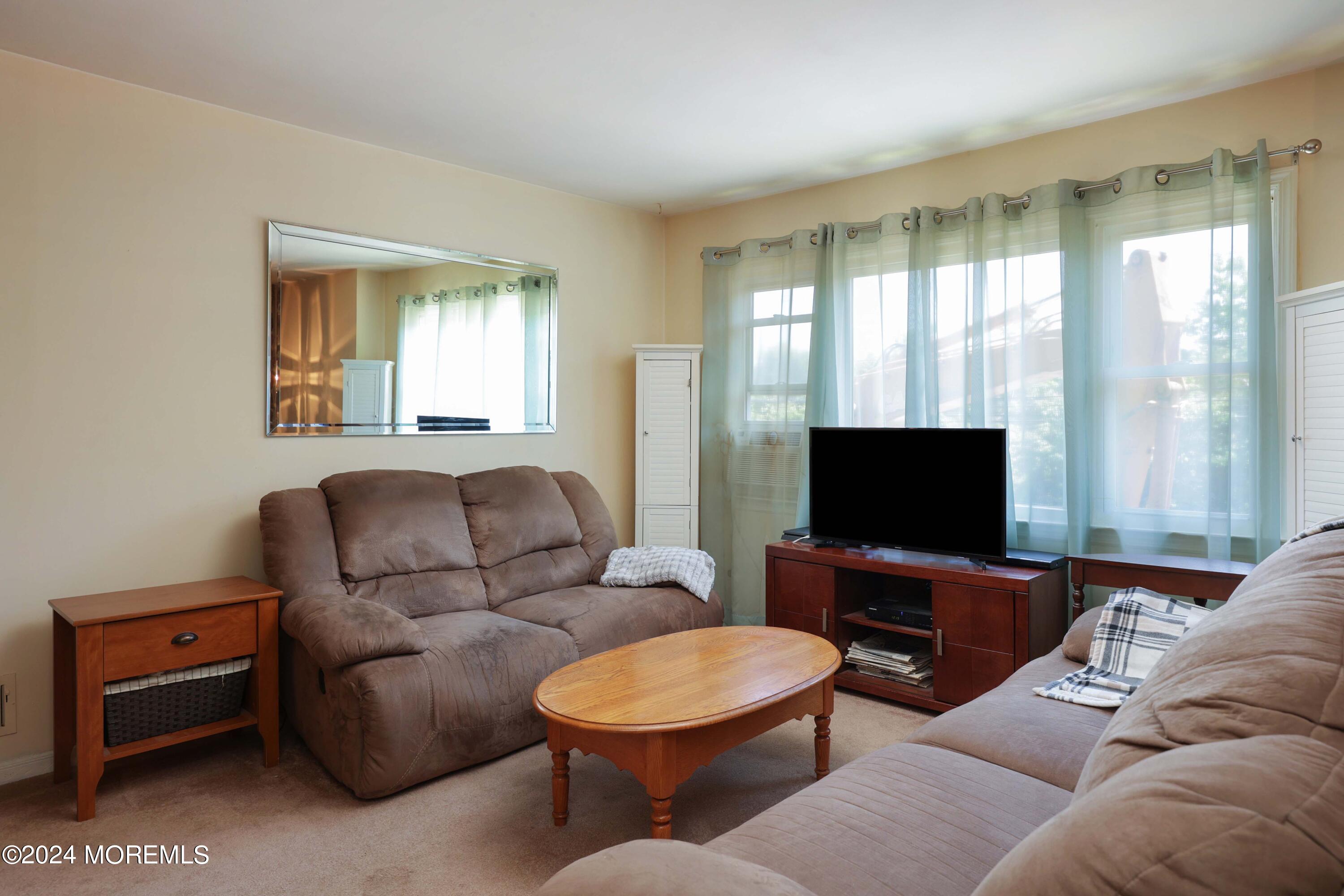 262 Cedar Swamp Road Jackson, NJ 08527 - Photo 4 of 28 a living room with furniture and a flat screen tv