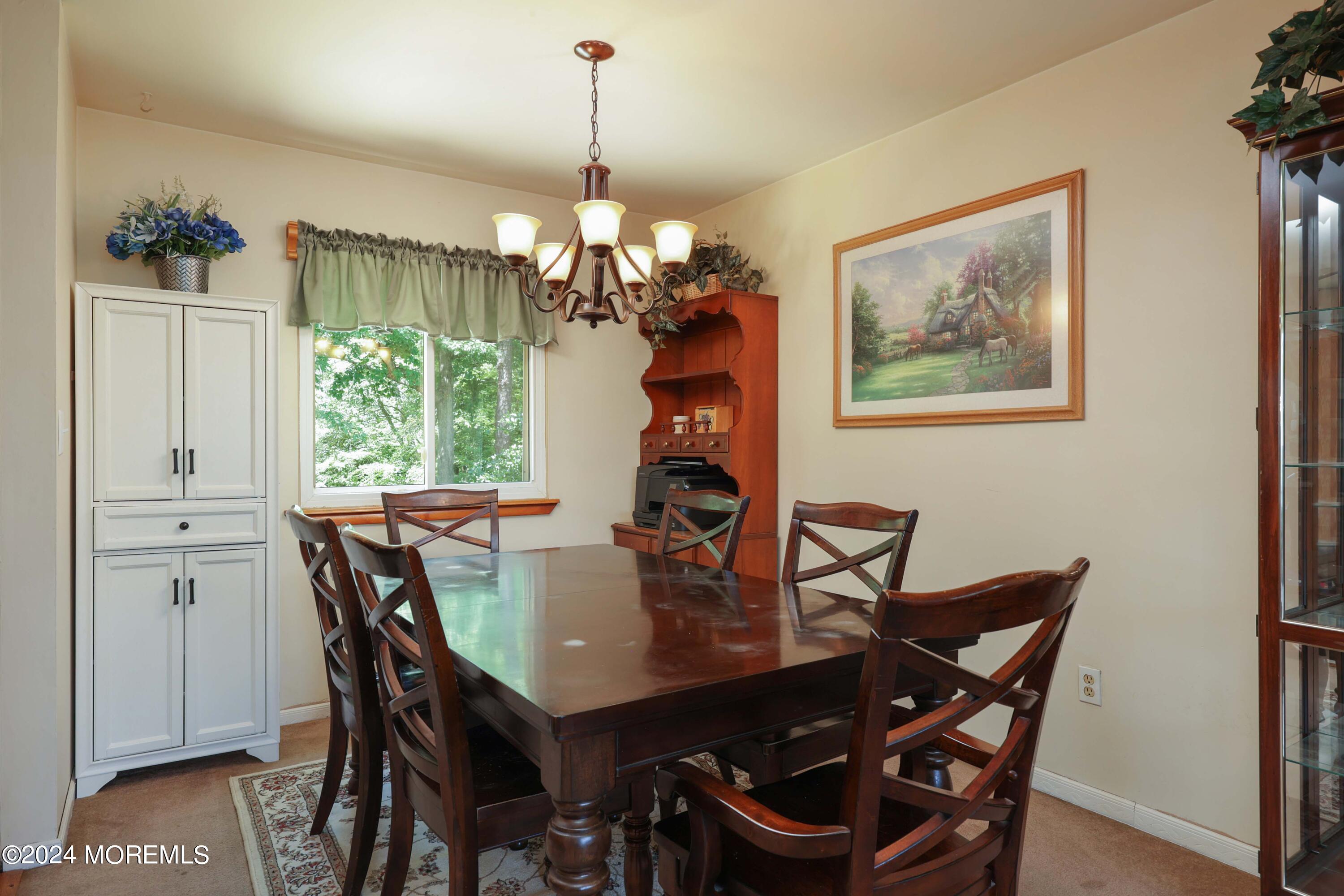 262 Cedar Swamp Road Jackson, NJ 08527 - Photo 7 of 28 a view of a dining room with furniture window and wooden floor