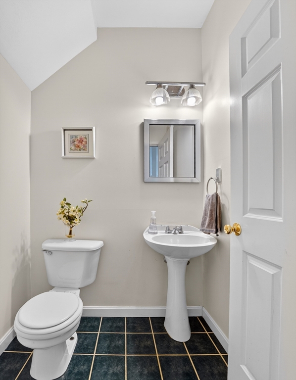 15 Evergreen Circle, Unit 15 Canton, MA 02021 - Photo 8 of 29 a bathroom with a toilet sink and mirror
