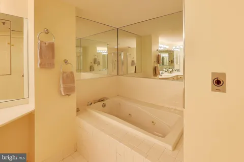 a balcony with table and chairs