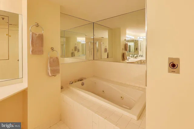 a balcony with table and chairs