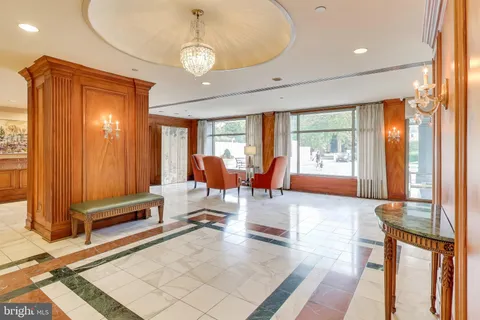 a view of hallway with a shower and closet