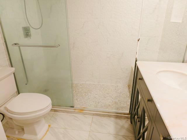100 Cutter Mill Road, Unit 4G Great Neck, NY 11021 - Photo 11 of 18 Bathroom with vanity and a stall shower