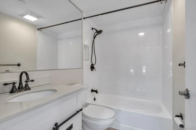 a bathroom with a sink a toilet and a bathtub