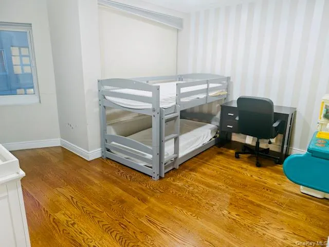 a bedroom with a bed and a cabinets