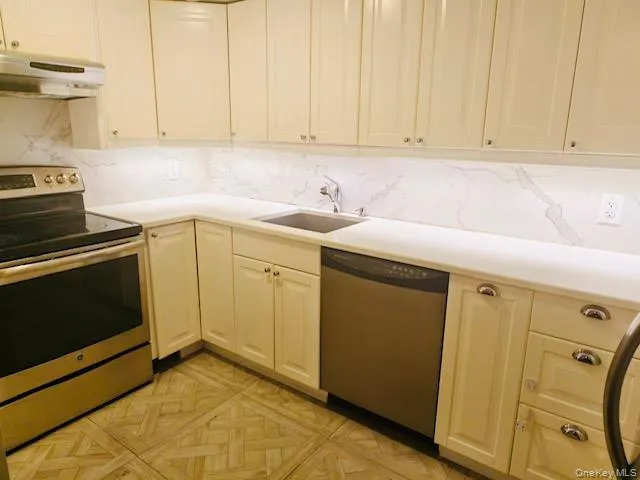 a view of a storage and utility room with a sink