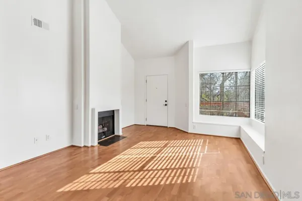 a kitchen with stainless steel appliances granite countertop a sink refrigerator and cabinets