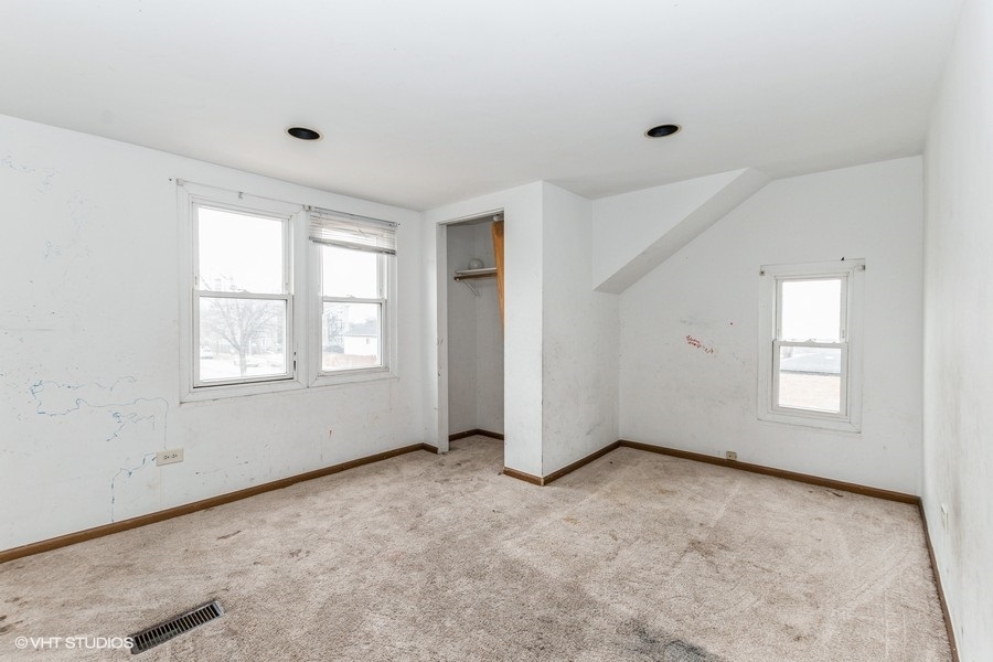 1436 West 110th Place Chicago, IL 60643 - Photo 7 of 10 an empty room with windows