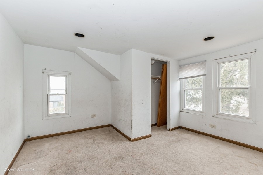 1436 West 110th Place Chicago, IL 60643 - Photo 8 of 10 an empty room with windows