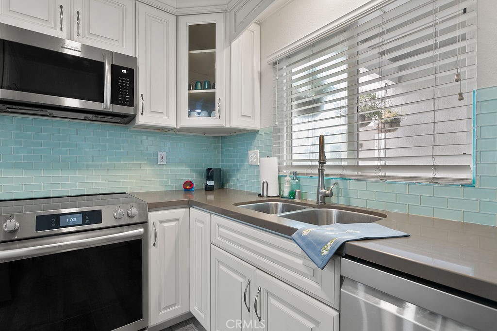 34110 Selva Road, Unit 328 Dana Point, CA 92629 - Photo 13 of 33 a kitchen with a sink and cabinets