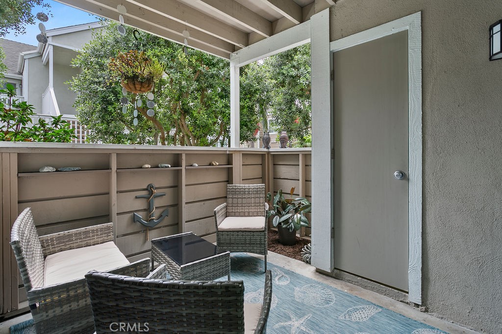 34110 Selva Road, Unit 328 Dana Point, CA 92629 - Photo 17 of 33 a view of a balcony with chair and potted plant