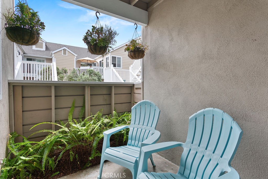 34110 Selva Road, Unit 328 Dana Point, CA 92629 - Photo 22 of 33 a view of a chair and table in the back yard