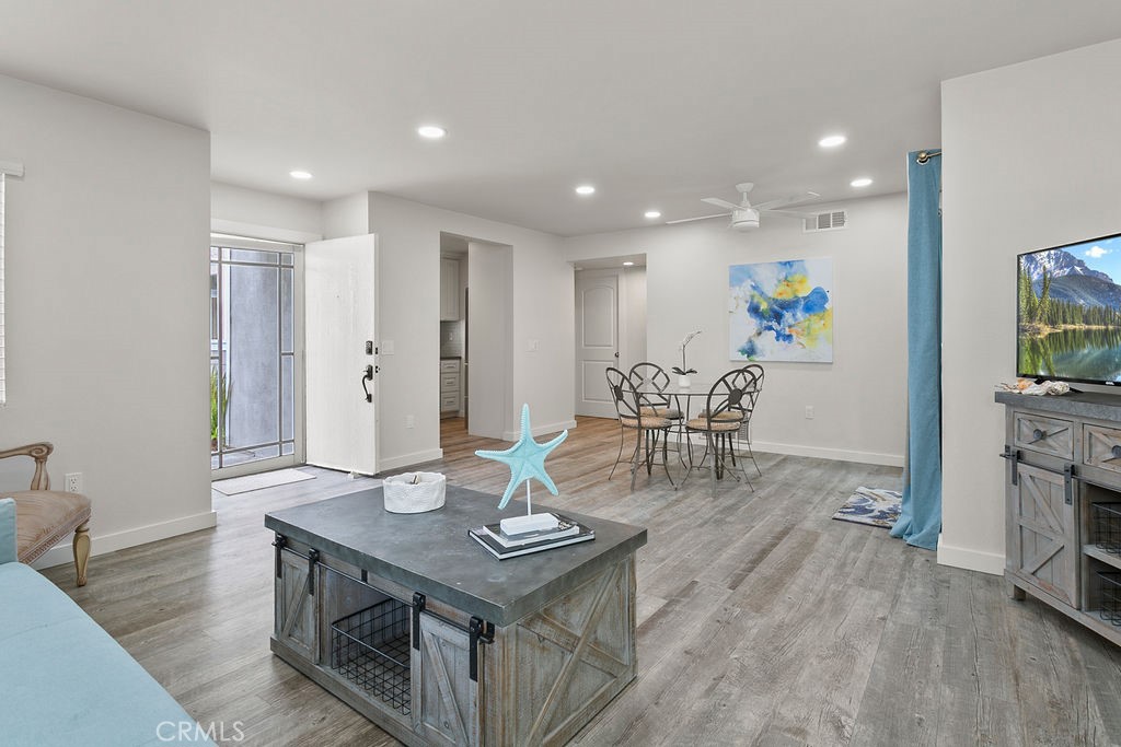 34110 Selva Road, Unit 328 Dana Point, CA 92629 - Photo 10 of 33 a view of a dining room with furniture and wooden floor