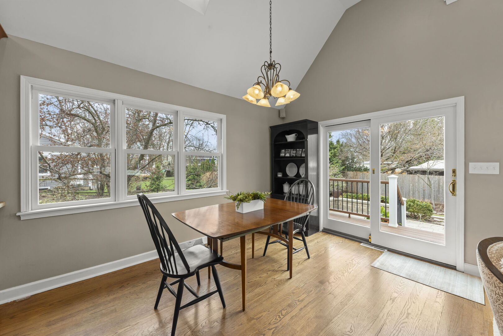 904 Gamon Road Wheaton, IL 60189 - Photo 13 of 47 a view of a dining room with furniture wooden floor and chandelier