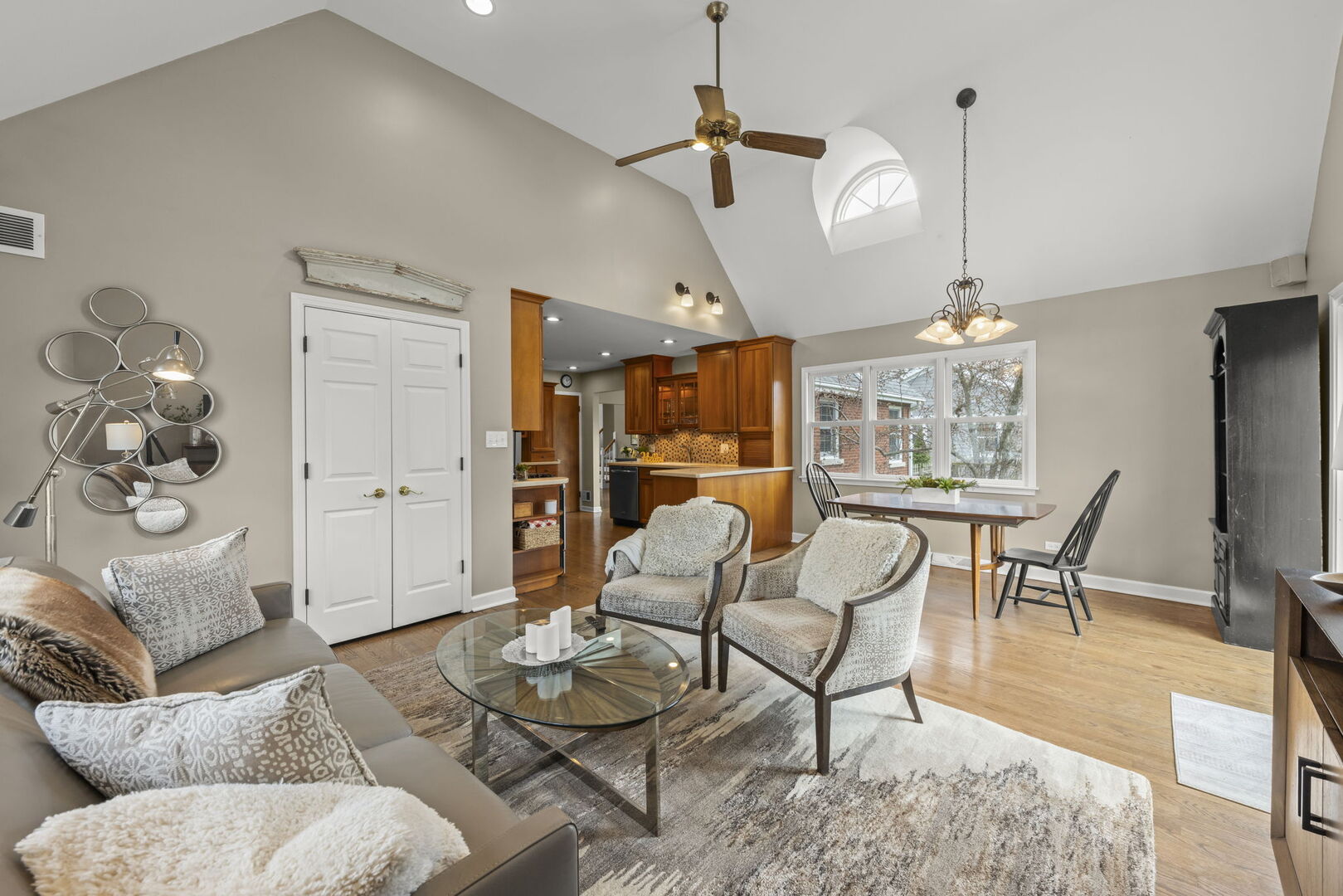 904 Gamon Road Wheaton, IL 60189 - Photo 14 of 47 a living room with furniture a chandelier and a dining table