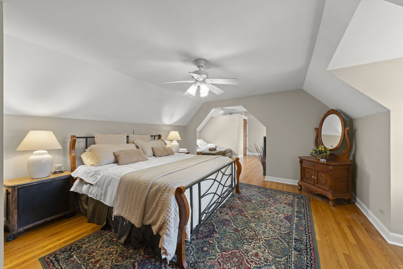 904 Gamon Road Wheaton, IL 60189 - Photo 19 of 47 a bedroom with a bed and a chandelier