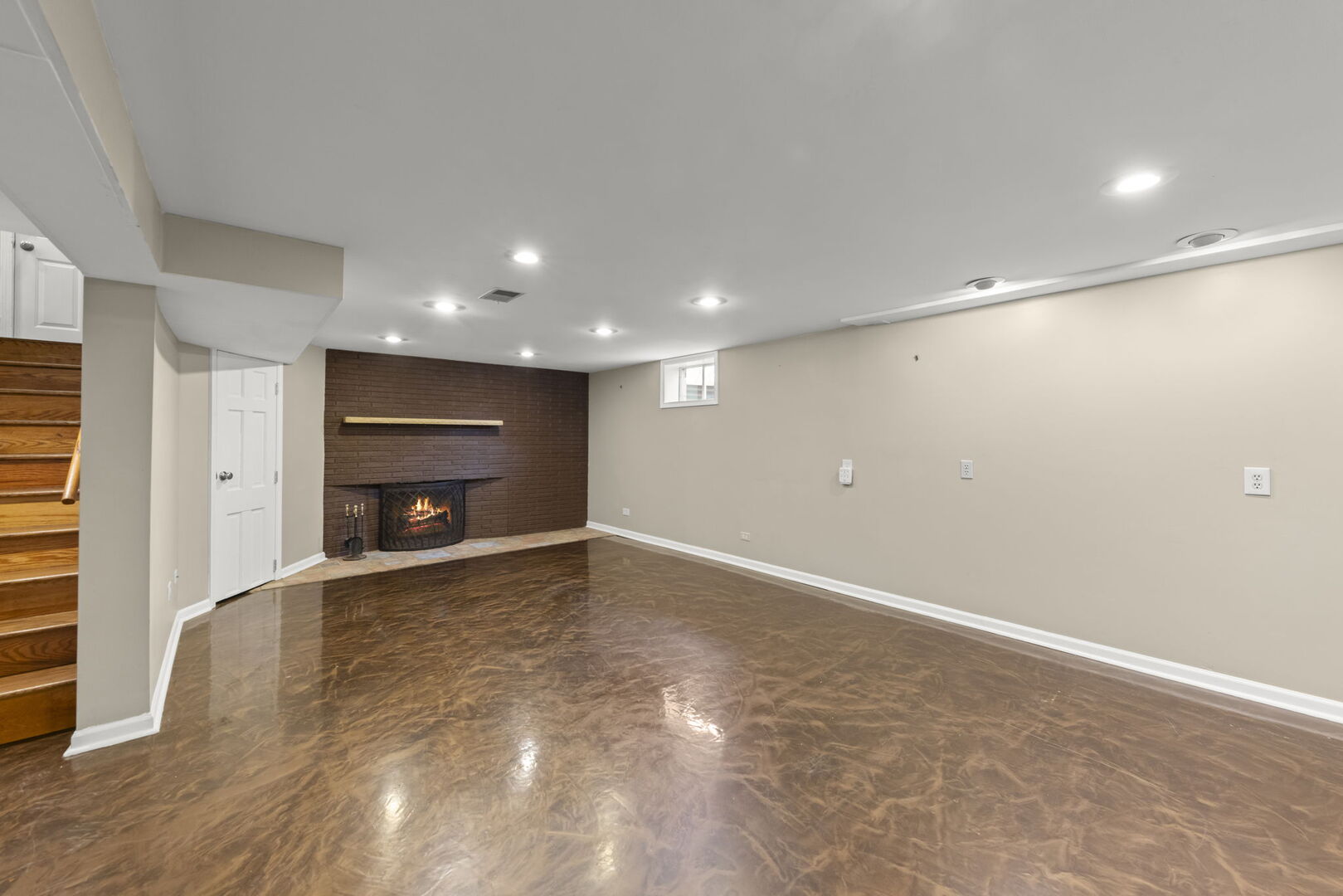 904 Gamon Road Wheaton, IL 60189 - Photo 27 of 47 a view of an empty room with a fireplace