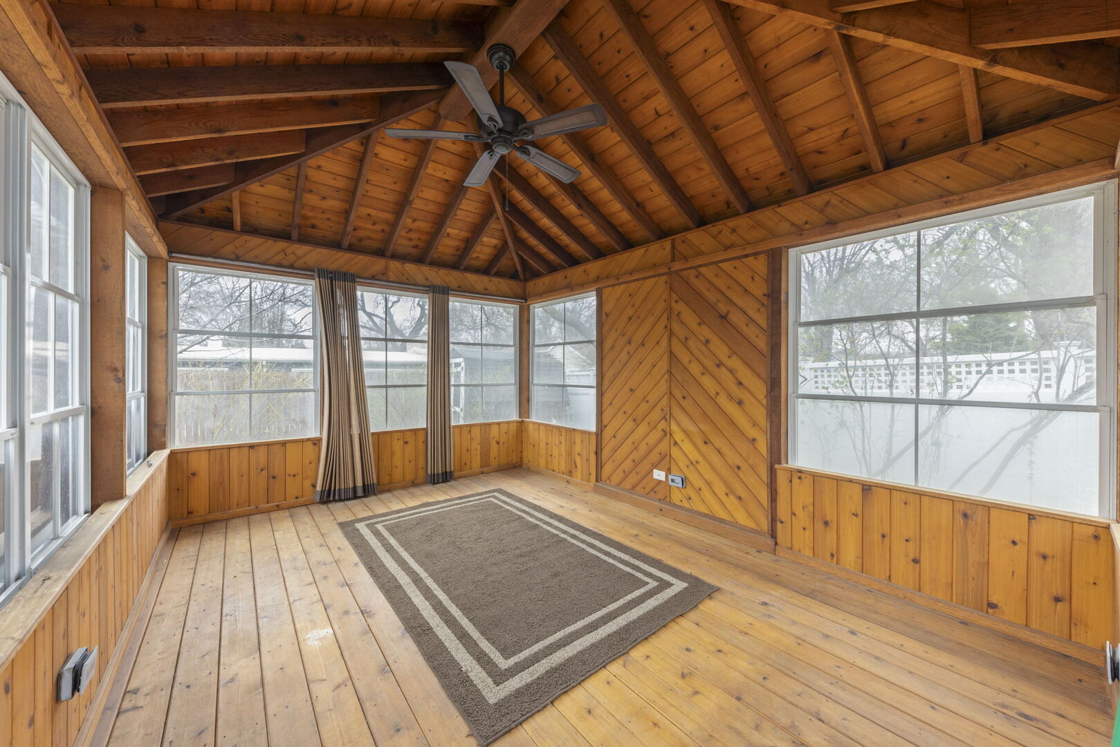 904 Gamon Road Wheaton, IL 60189 - Photo 34 of 47 a view of an empty room with wooden floor and a window