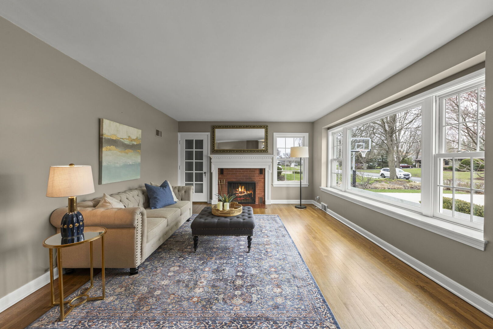 904 Gamon Road Wheaton, IL 60189 - Photo 6 of 47 a living room with furniture large window and a fireplace