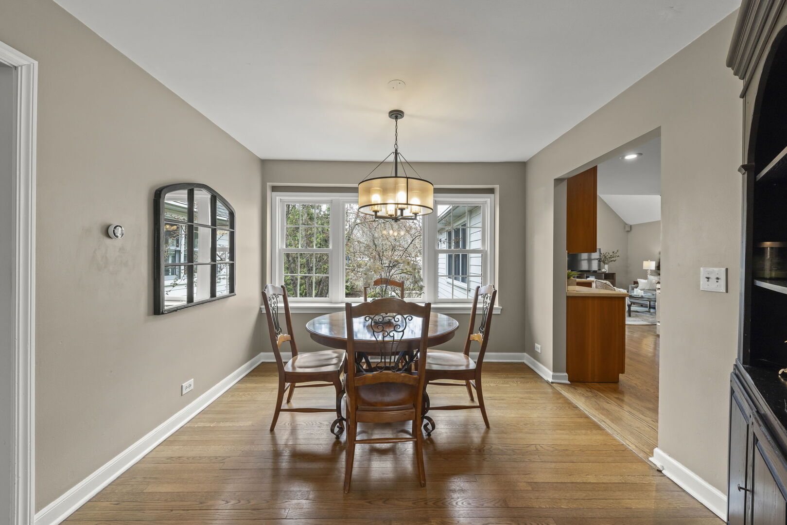 904 Gamon Road Wheaton, IL 60189 - Photo 7 of 47 a view of a dining room with furniture window and wooden floor