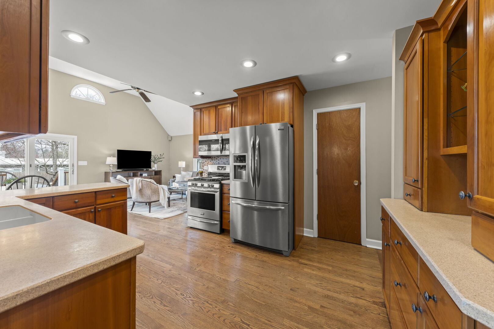 904 Gamon Road Wheaton, IL 60189 - Photo 8 of 47 a kitchen with stainless steel appliances granite countertop a refrigerator a sink a stove top oven a dining table and chairs