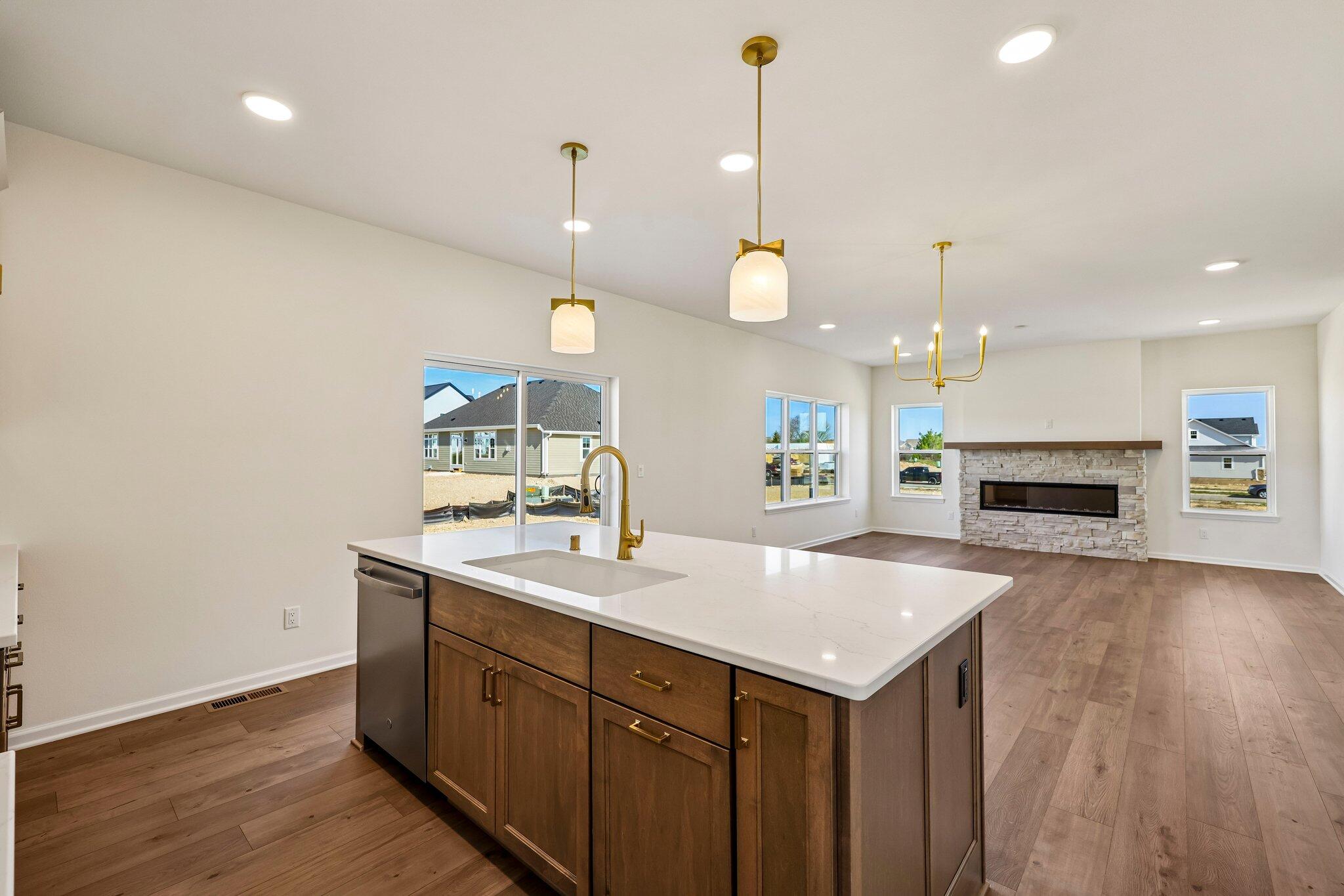 447 Sandstone Street Slinger, WI 53086 - Photo 16 of 38 Kitchen Open to Dinette & GR