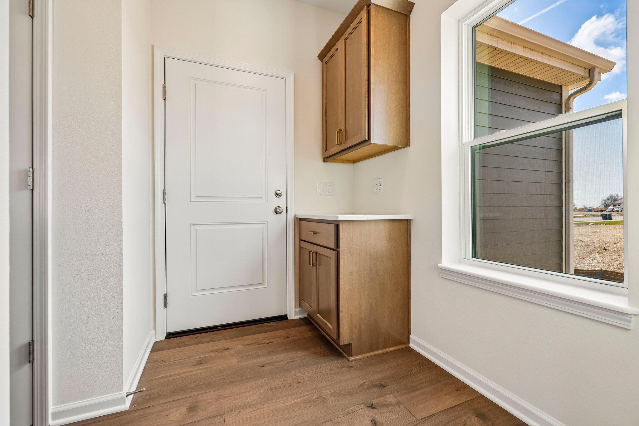 447 Sandstone Street Slinger, WI 53086 - Photo 17 of 38 Rear Foyer w/ Drop Zone