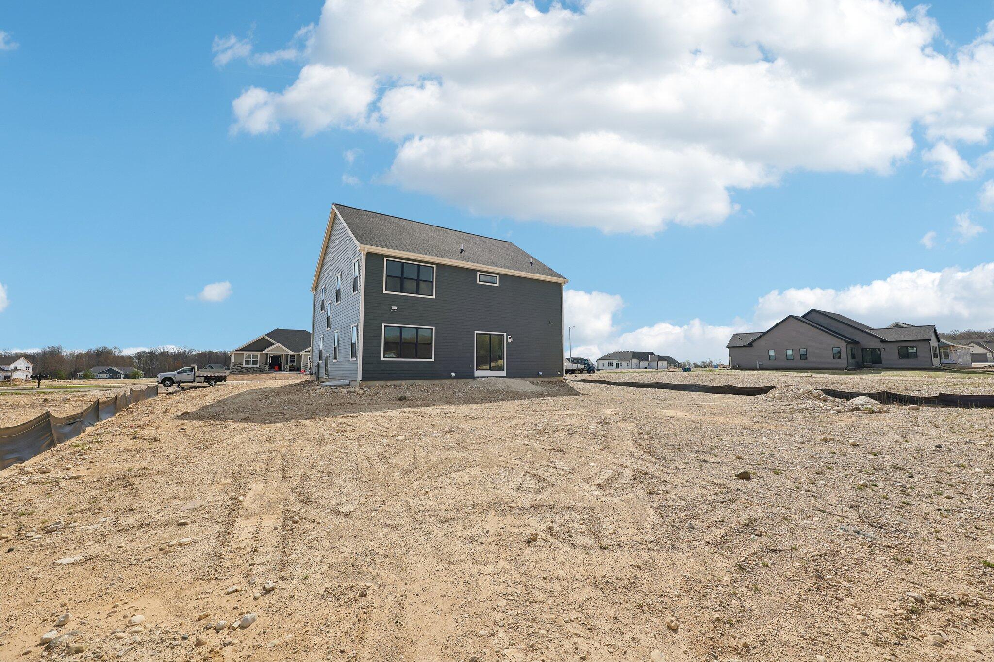 447 Sandstone Street Slinger, WI 53086 - Photo 36 of 38 Spacious Backyard