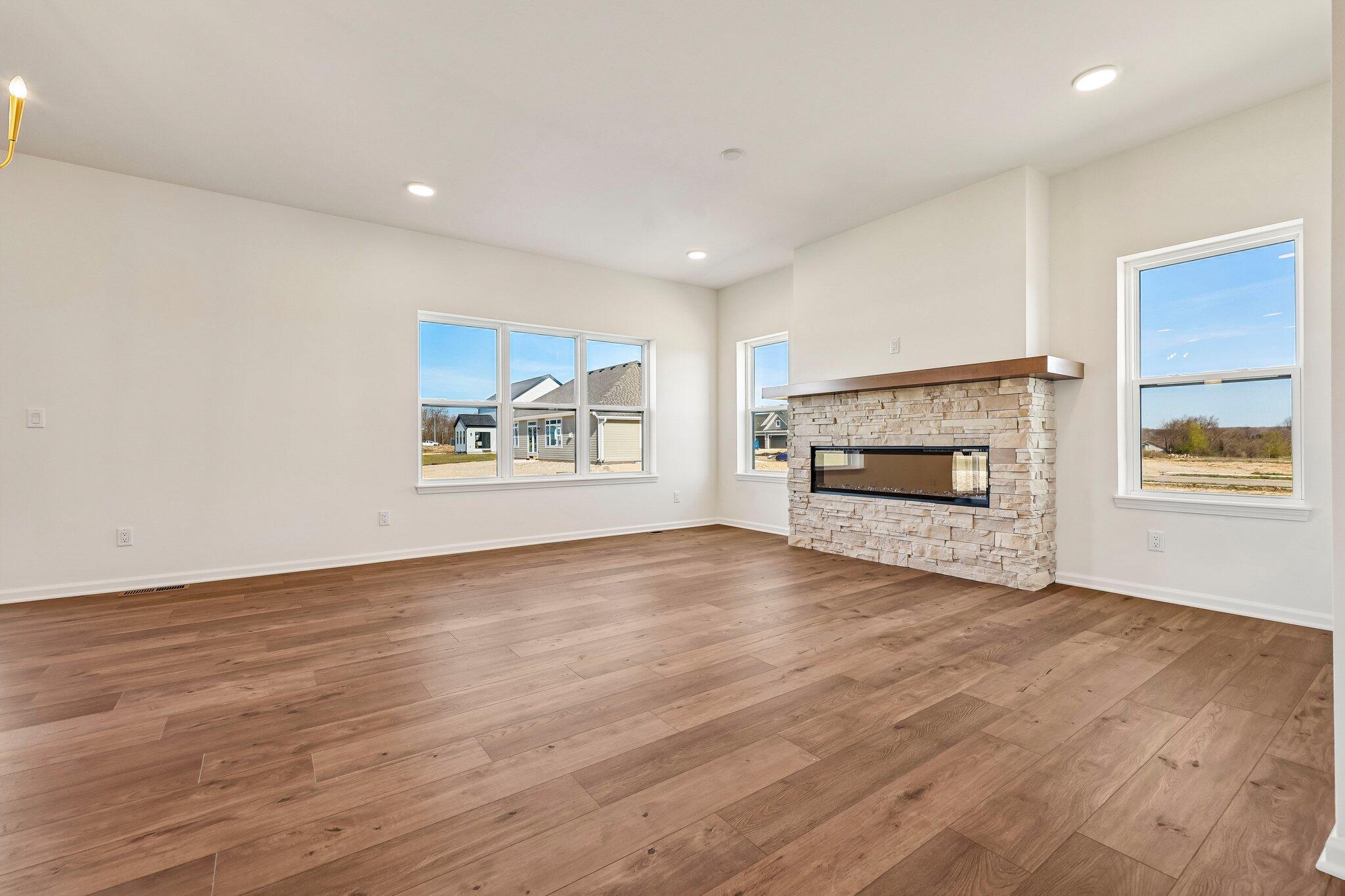 447 Sandstone Street Slinger, WI 53086 - Photo 7 of 38 Great Room w/ Electric Fireplace