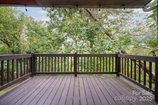 a view of balcony with wooden floor