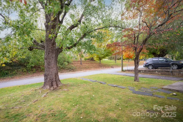 a view of swimming pool with a yard