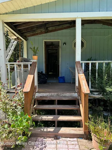 a view of backyard with wooden fences