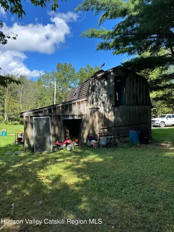 a view of a house with a tree