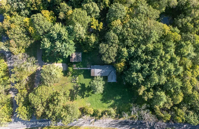 a view of a house with a tree