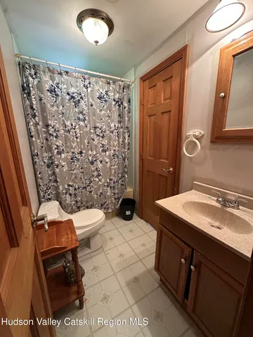 a bed room with furniture and a window