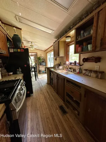 a bedroom with a bed and ceiling fan