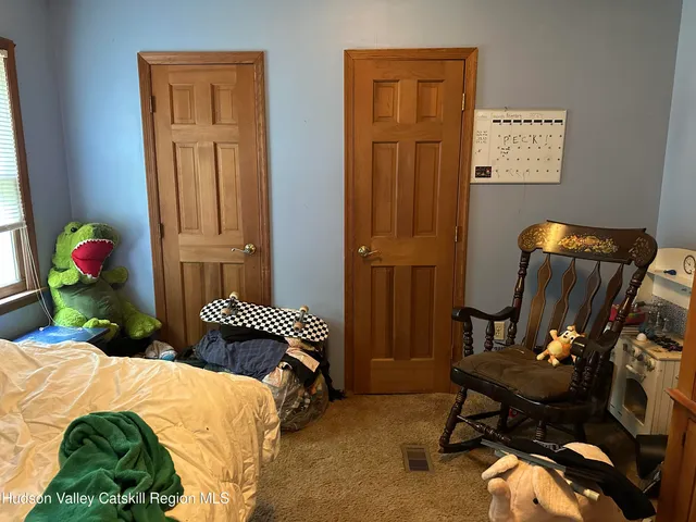 a view of an entryway with a floor to ceiling window