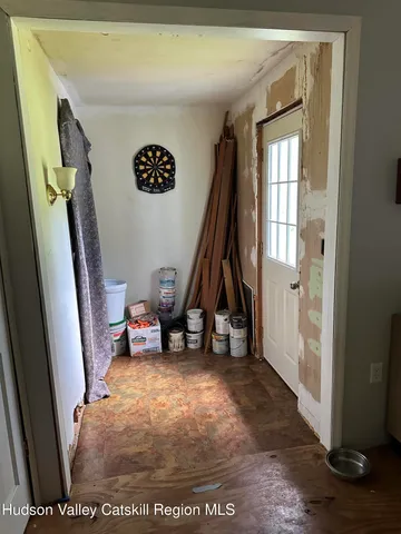 a view of a house with a tiny play tree