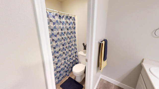 856 East 300 South Provo, UT 84606 - Photo 8 of 9 Full bathroom with vanity, a shower with shower curtain, and light wood-type flooring